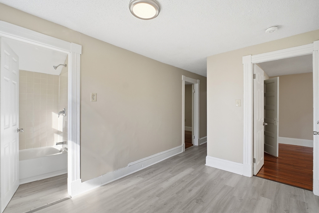 51-53 Abbe Avenue Springfield, MA 01107 - Photo 35 of 42 a view of a livingroom with wooden floor and a bathroom