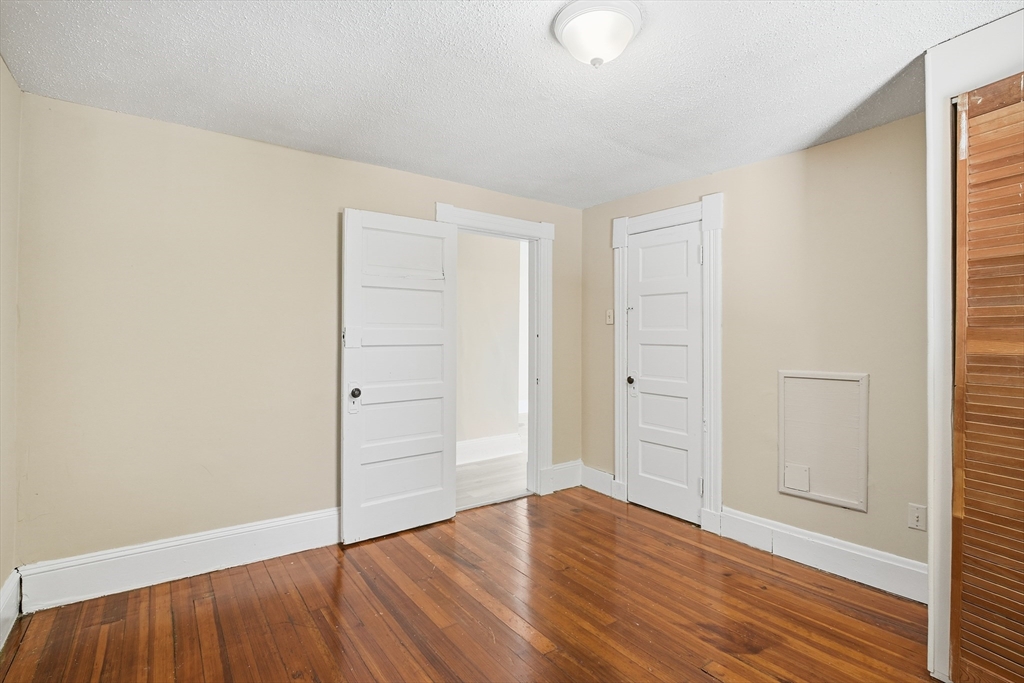 51-53 Abbe Avenue Springfield, MA 01107 - Photo 38 of 42 an empty room with wooden floor and closet