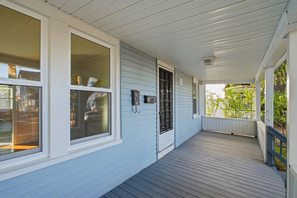 51-53 Abbe Avenue Springfield, MA 01107 - Photo 4 of 42 a view of empty room with wooden floor and fan