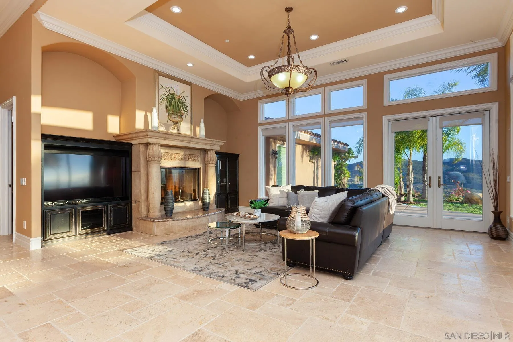29314 Twin Oaks Valley Road Vista, CA 92084 - Photo 11 of 74 a living room with furniture a chandelier and a large window