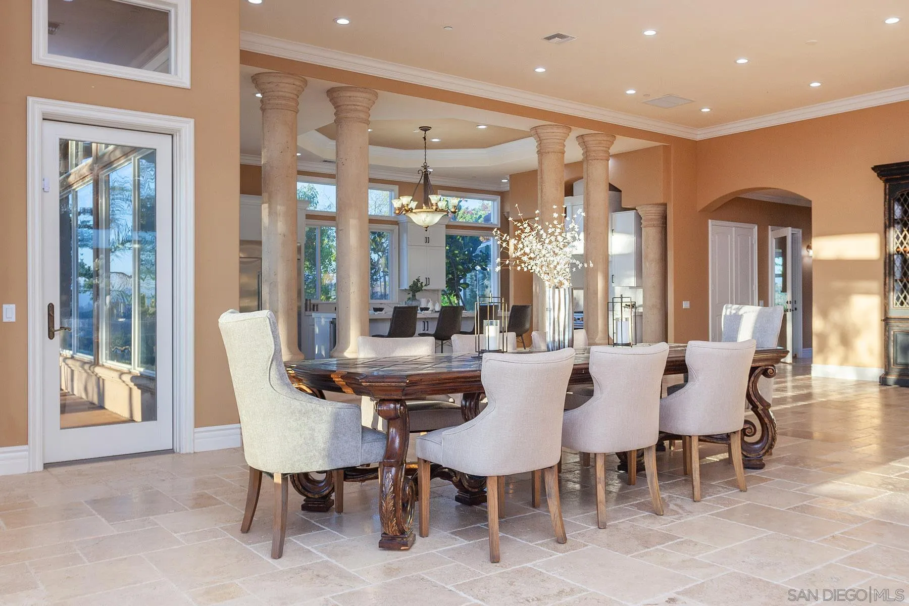 29314 Twin Oaks Valley Road Vista, CA 92084 - Photo 15 of 74 a view of a dining room with furniture wooden floor and a chandelier