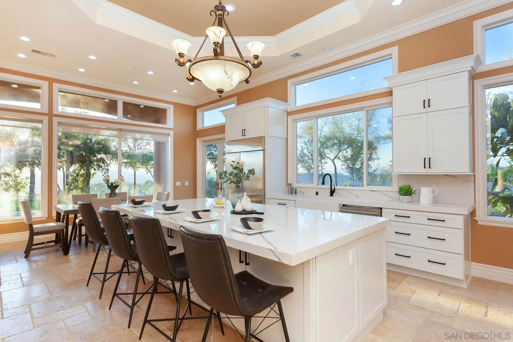 29314 Twin Oaks Valley Road Vista, CA 92084 - Photo 19 of 74 a room with stainless steel appliances kitchen island granite countertop furniture and a large window