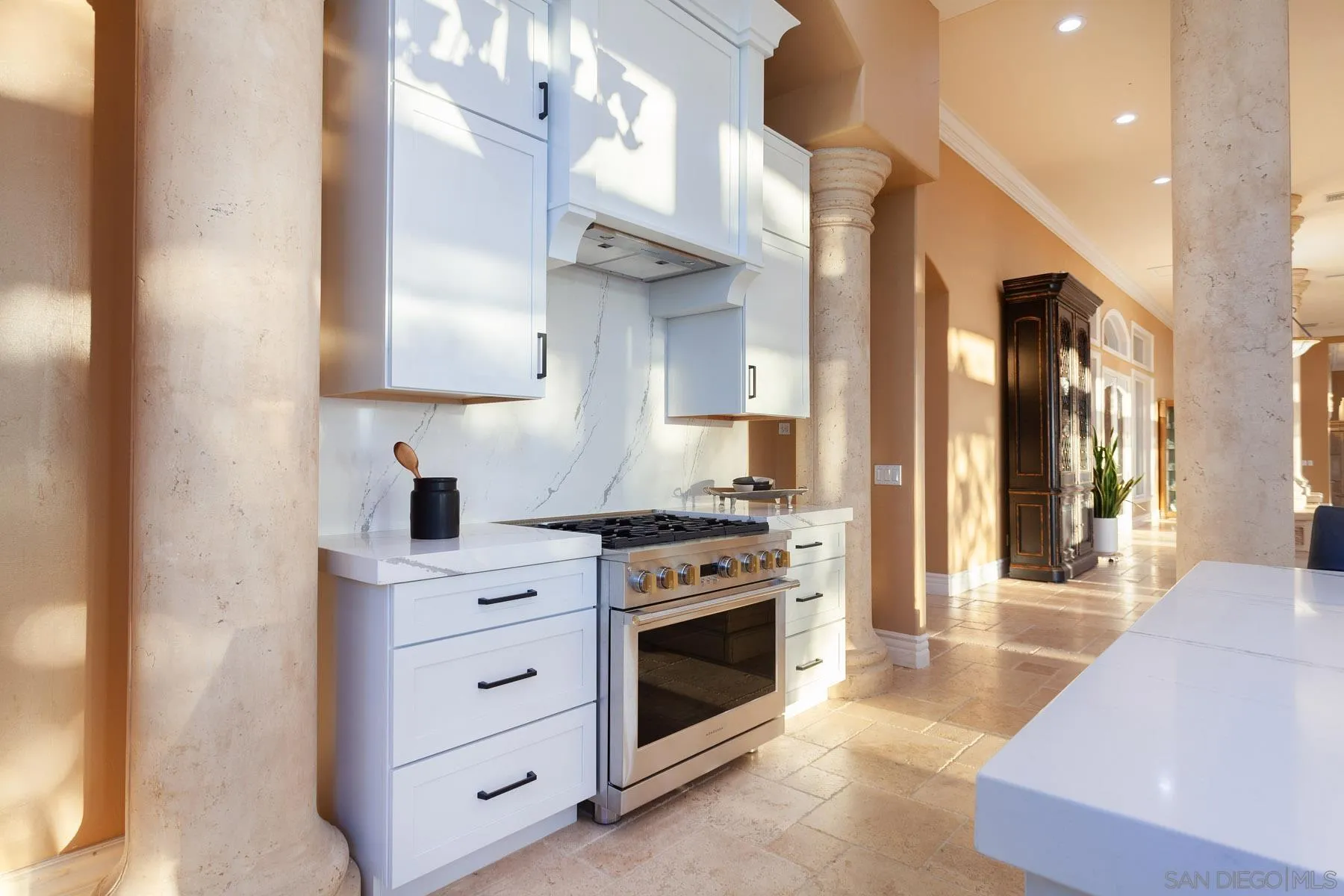 29314 Twin Oaks Valley Road Vista, CA 92084 - Photo 20 of 74 a kitchen with stainless steel appliances granite countertop a stove and a sink