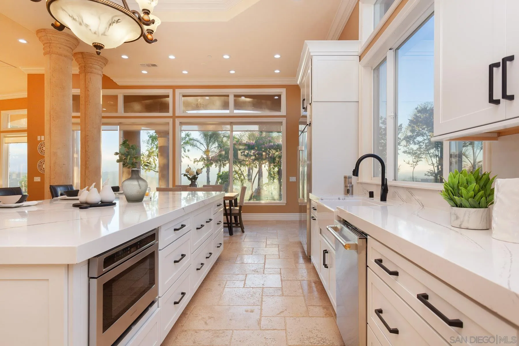 29314 Twin Oaks Valley Road Vista, CA 92084 - Photo 21 of 74 a large white kitchen with a large window