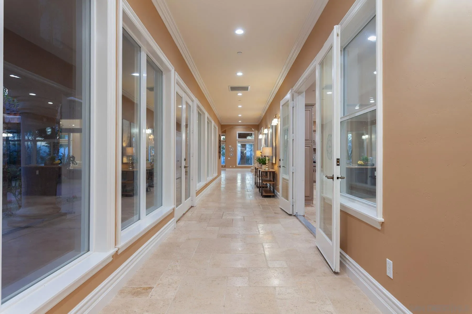 29314 Twin Oaks Valley Road Vista, CA 92084 - Photo 23 of 74 a view of a hallway with wooden floor and a bathroom