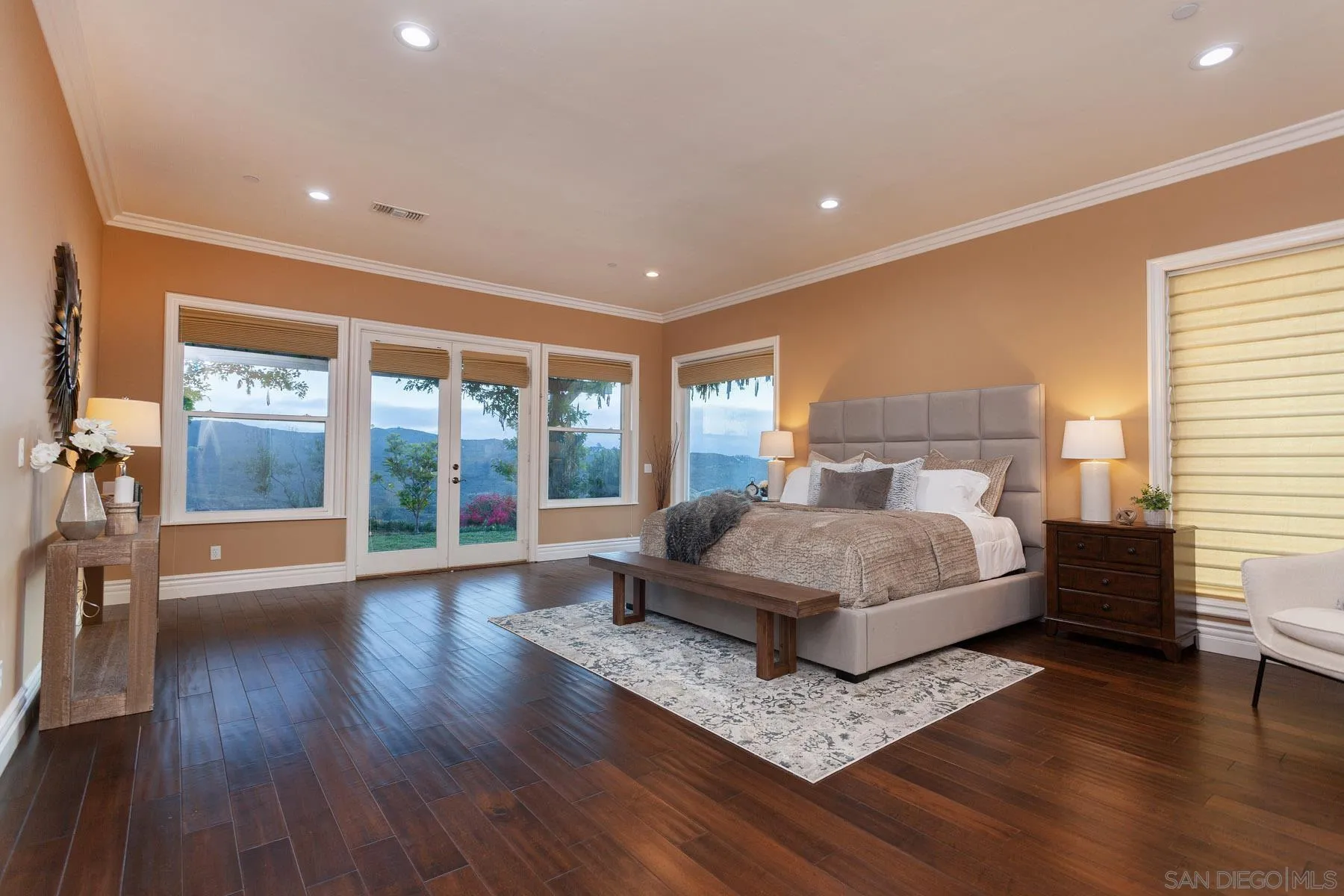 29314 Twin Oaks Valley Road Vista, CA 92084 - Photo 25 of 74 a bedroom with a large bed and a large window