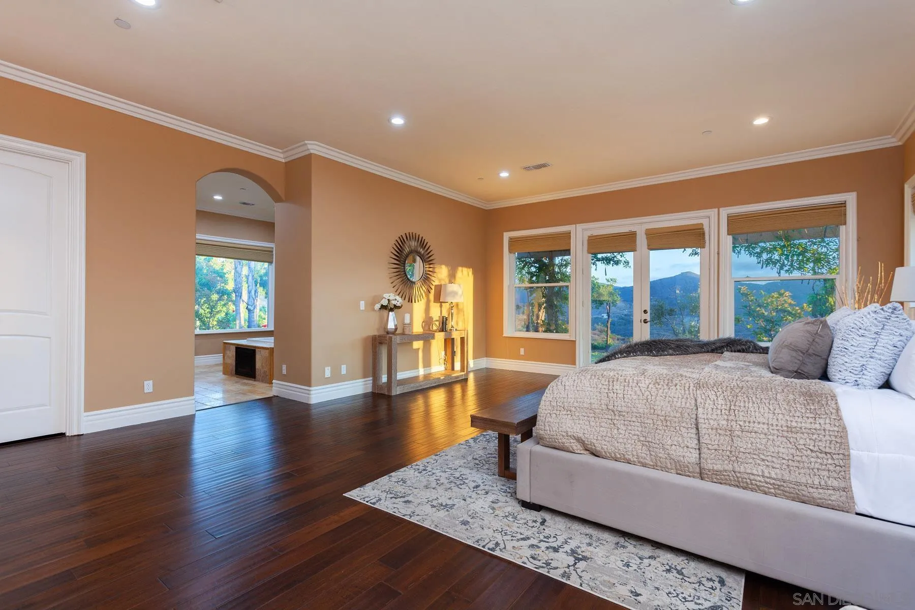 29314 Twin Oaks Valley Road Vista, CA 92084 - Photo 26 of 74 a living room with a bed furniture and a large window
