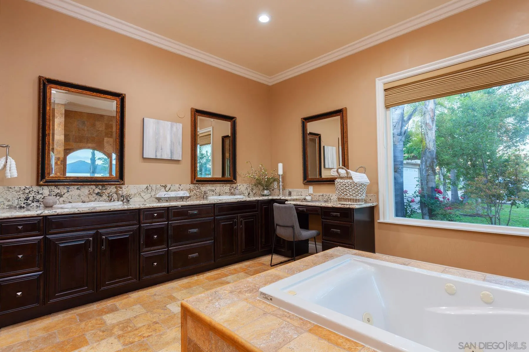 29314 Twin Oaks Valley Road Vista, CA 92084 - Photo 27 of 74 a spacious bathroom with a tub sink and mirror