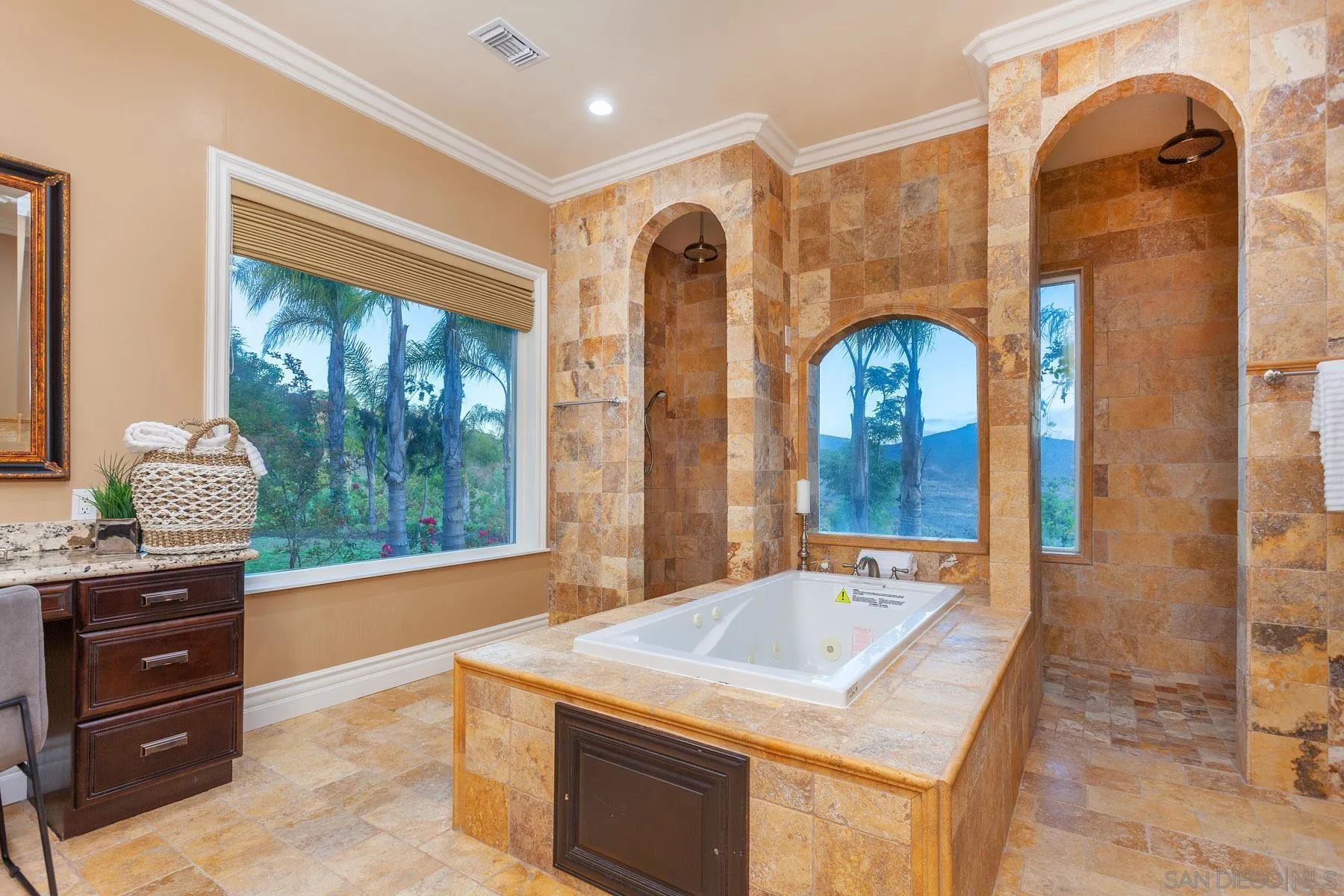 29314 Twin Oaks Valley Road Vista, CA 92084 - Photo 28 of 74 a bathroom with a granite countertop sink a large mirror and a shower