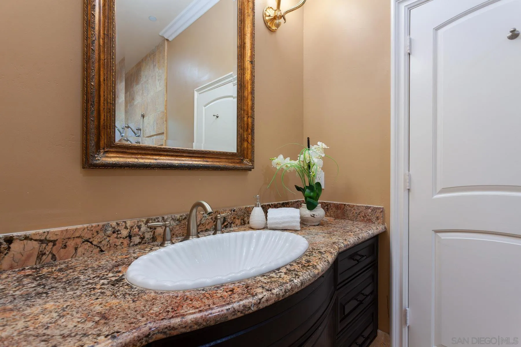 29314 Twin Oaks Valley Road Vista, CA 92084 - Photo 32 of 74 a bathroom with sink and mirror