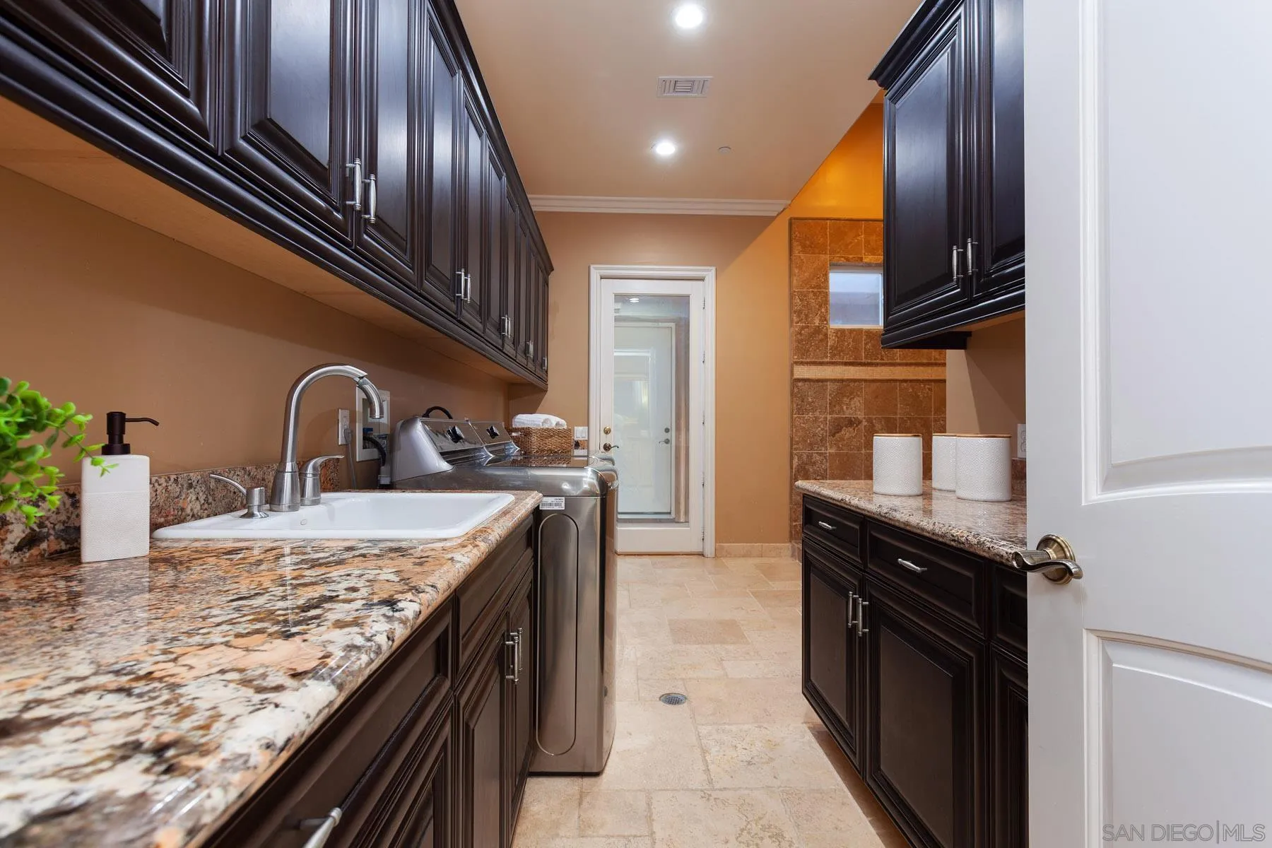 29314 Twin Oaks Valley Road Vista, CA 92084 - Photo 35 of 74 a kitchen with granite countertop stainless steel appliances and sink