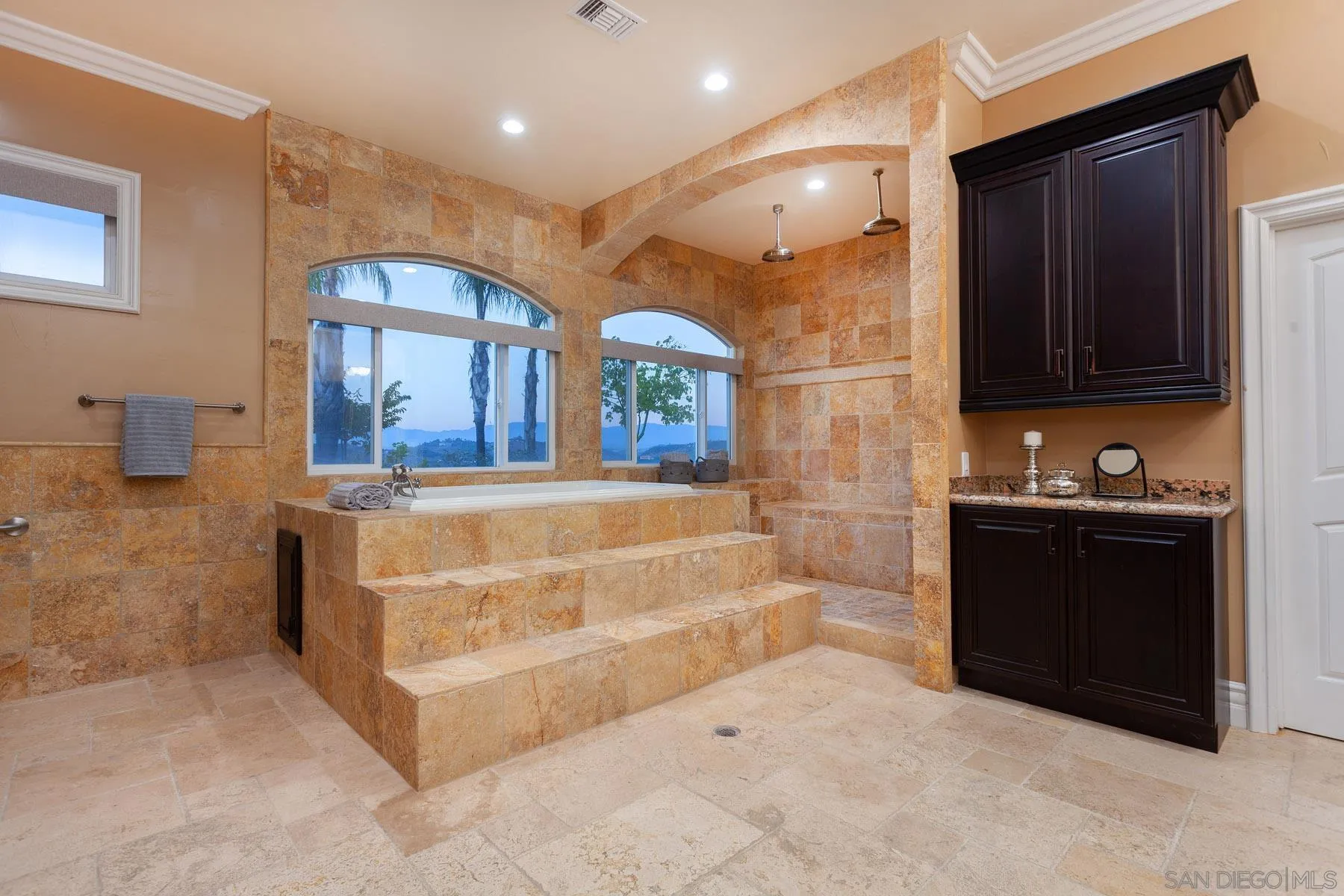 29314 Twin Oaks Valley Road Vista, CA 92084 - Photo 40 of 74 a bathroom with double vanity and a mirror