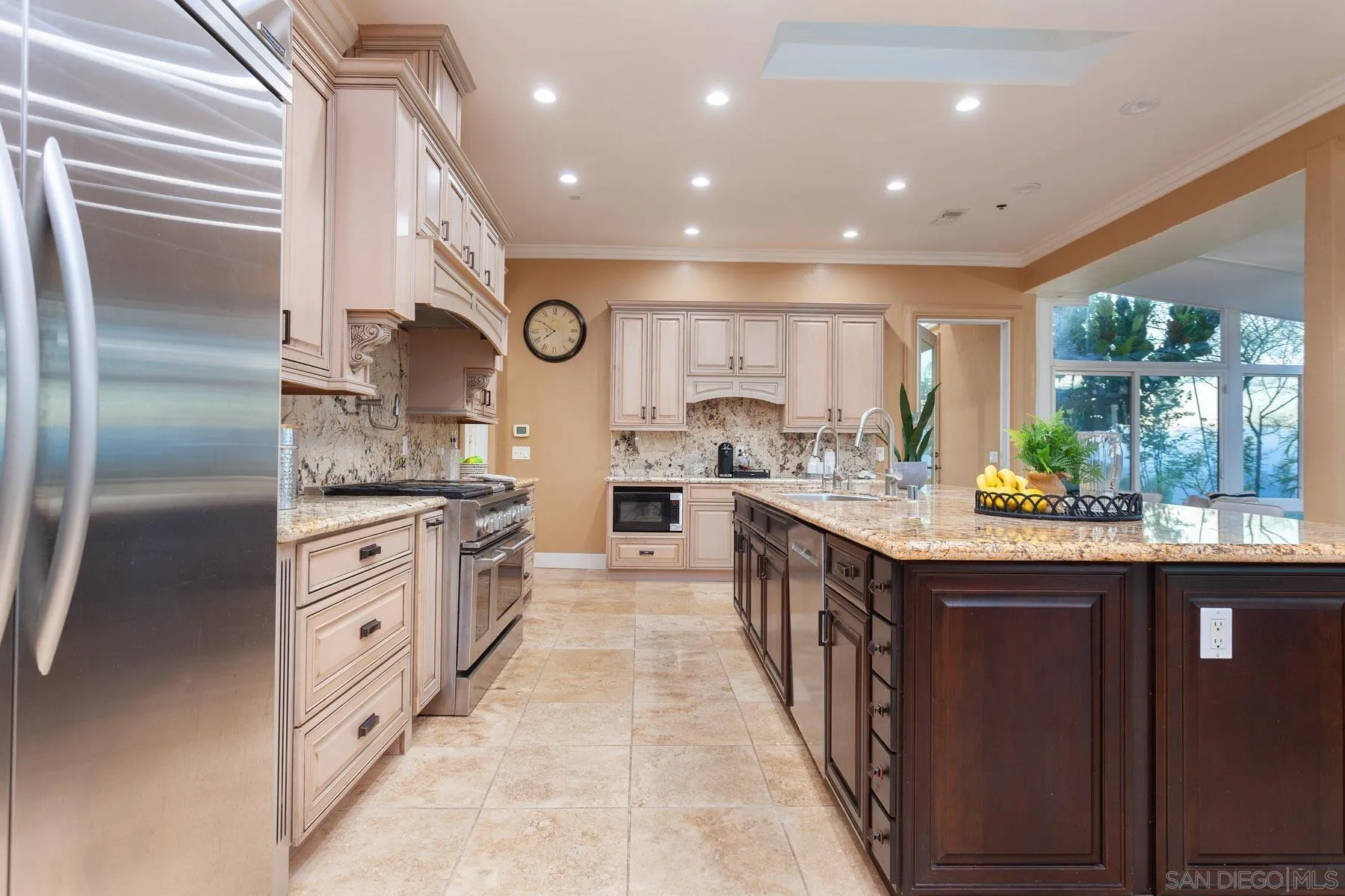 29314 Twin Oaks Valley Road Vista, CA 92084 - Photo 43 of 74 a kitchen with stainless steel appliances granite countertop a large stove top oven and cabinets
