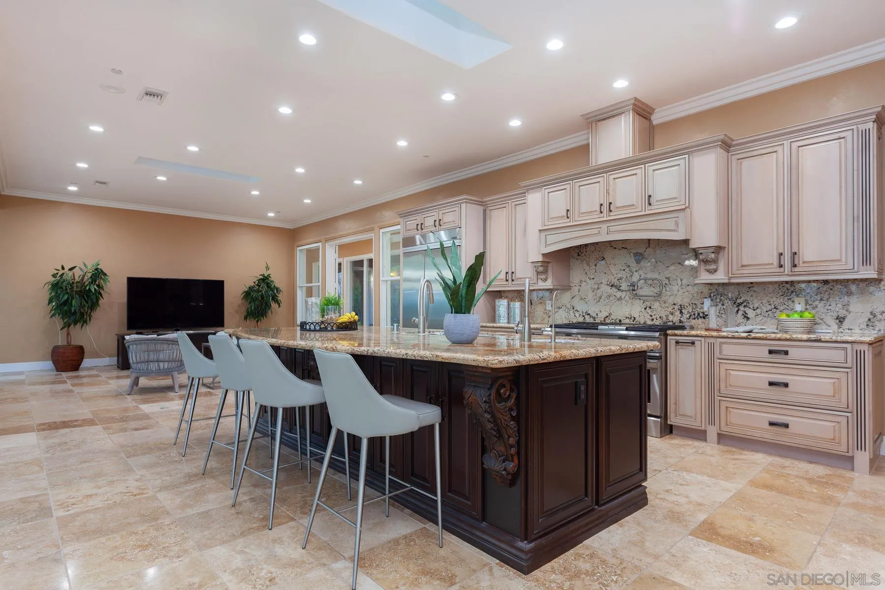 29314 Twin Oaks Valley Road Vista, CA 92084 - Photo 45 of 74 a kitchen with stainless steel appliances kitchen island granite countertop a sink and cabinets