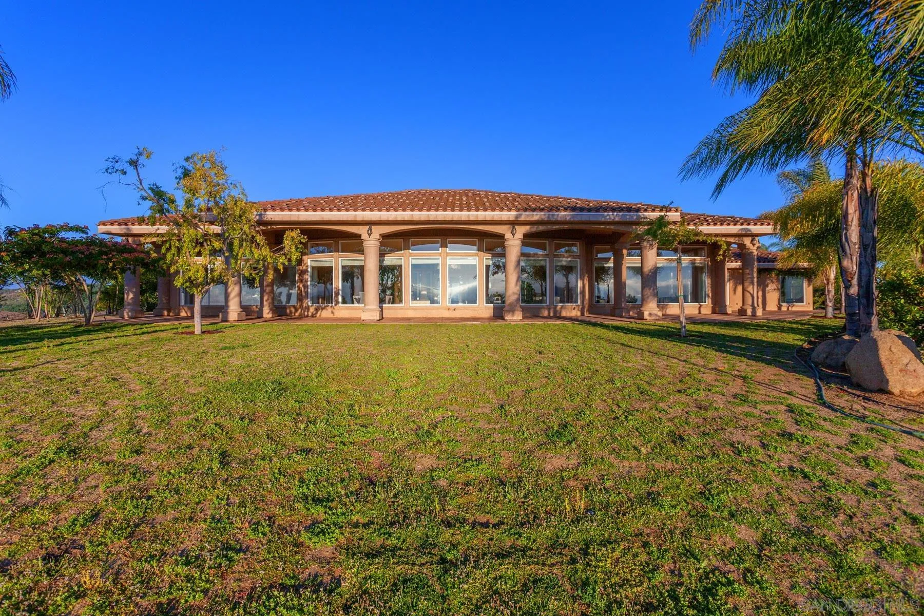 29314 Twin Oaks Valley Road Vista, CA 92084 - Photo 55 of 74 a front view of a house with a yard