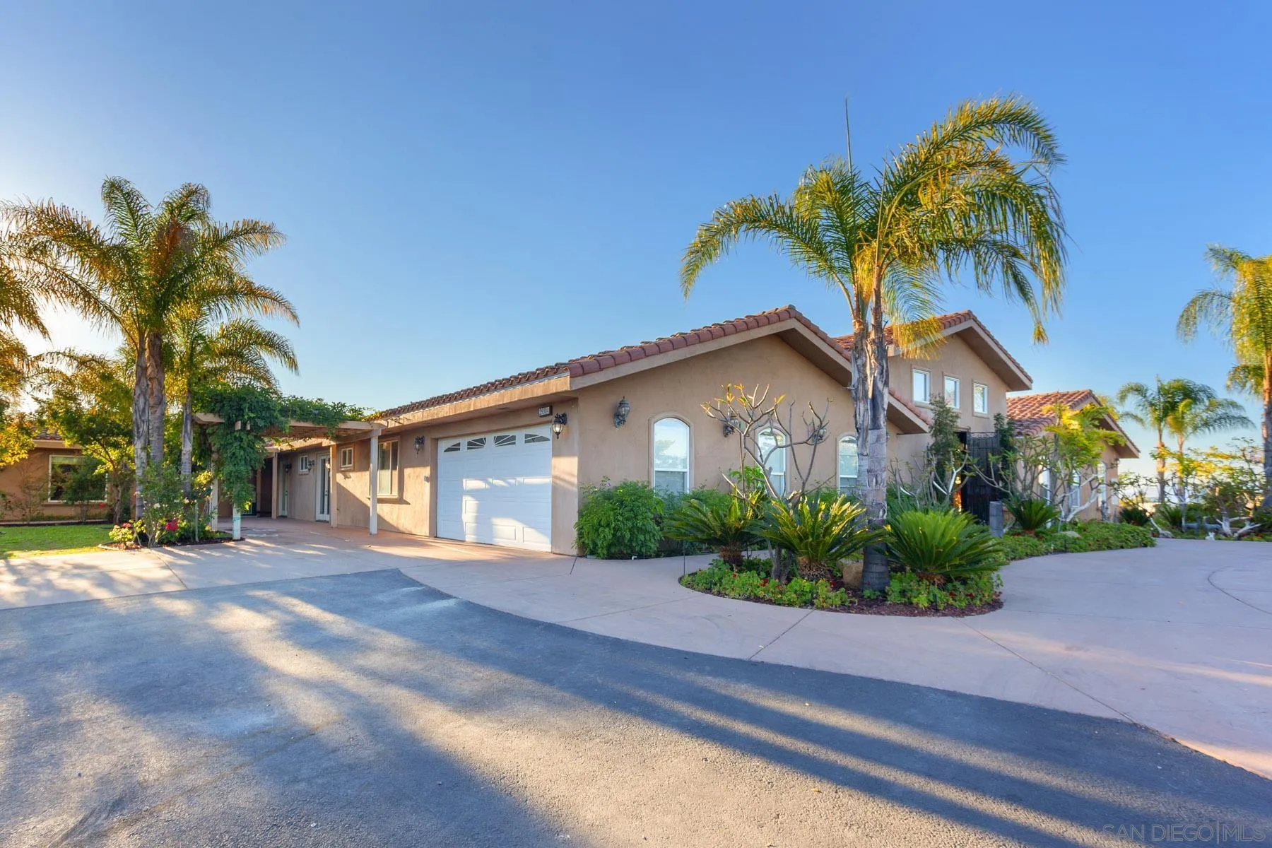 29314 Twin Oaks Valley Road Vista, CA 92084 - Photo 71 of 74 a front view of a house with garden