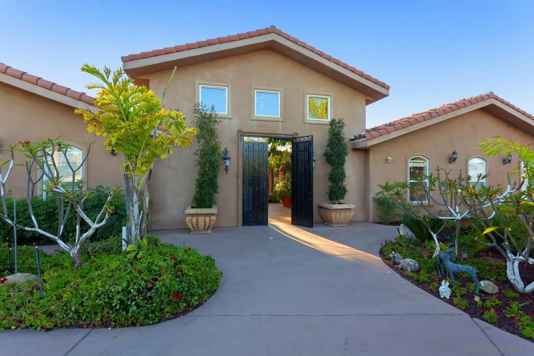 29314 Twin Oaks Valley Road Vista, CA 92084 - Photo 72 of 74 a front view of a house with a yard