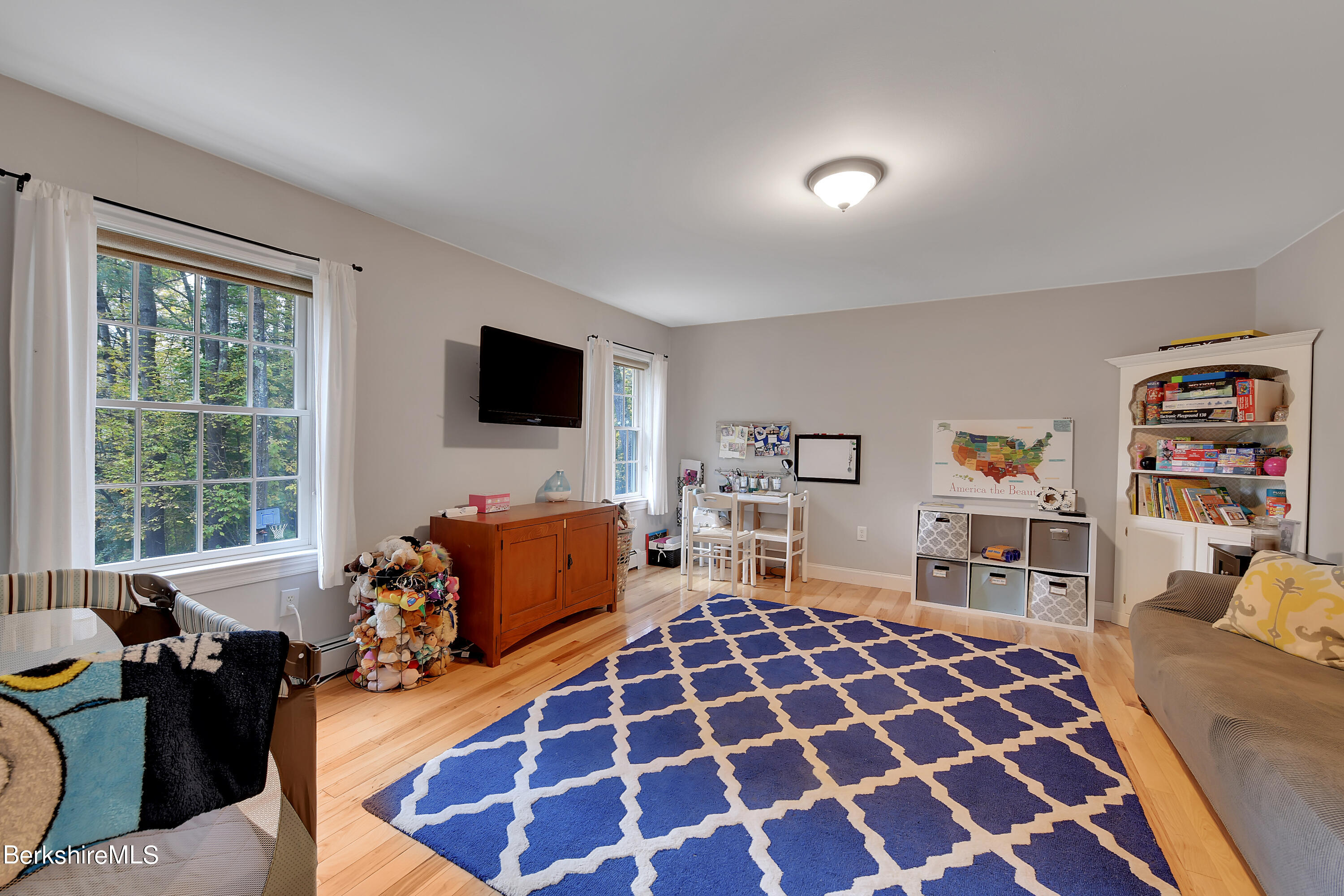 3 Ridge Street Tyringham, MA 01238 - Photo 14 of 38 a bedroom with a bed and wooden floor