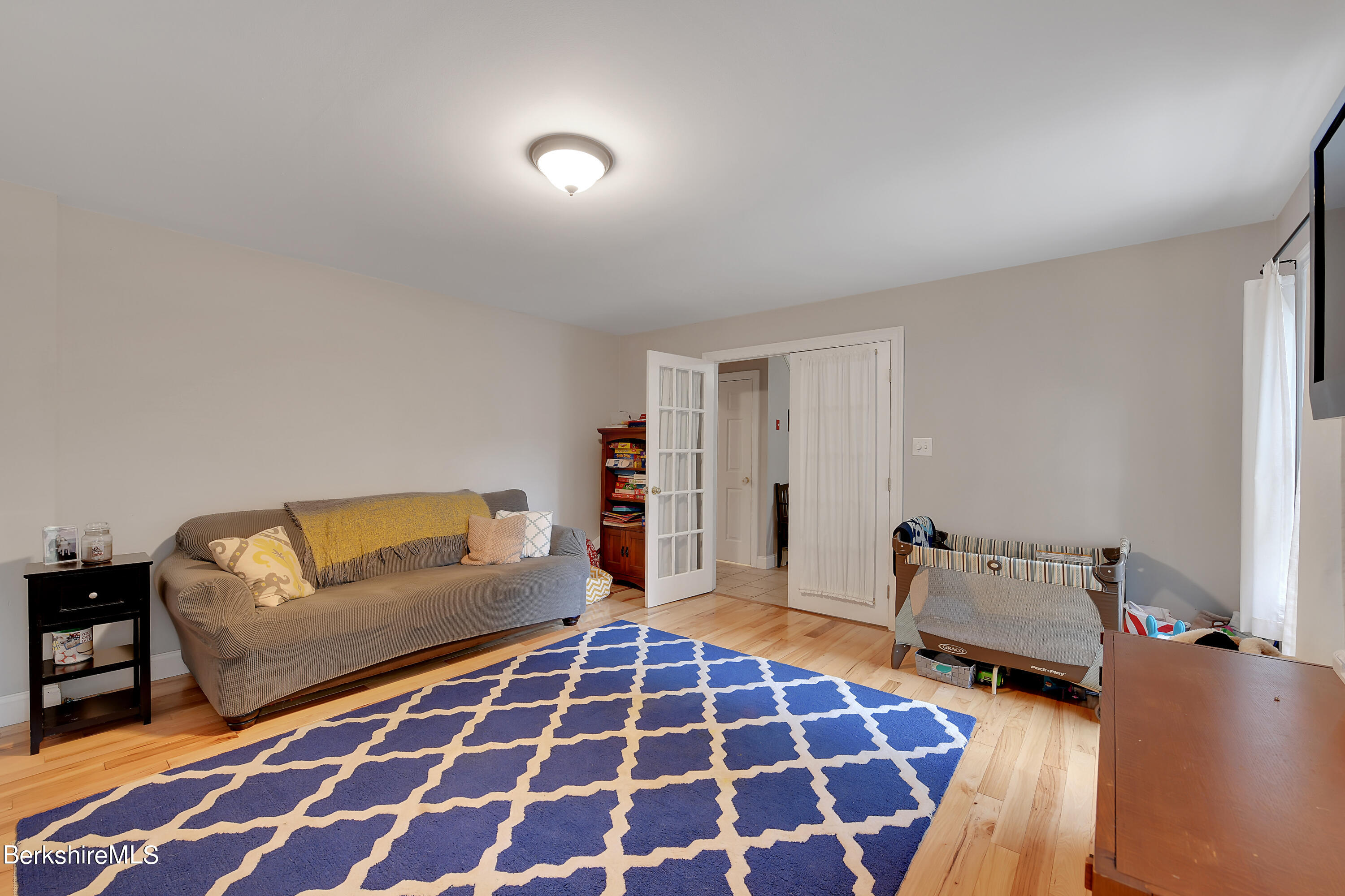 3 Ridge Street Tyringham, MA 01238 - Photo 15 of 38 a bedroom with a bed and a couch