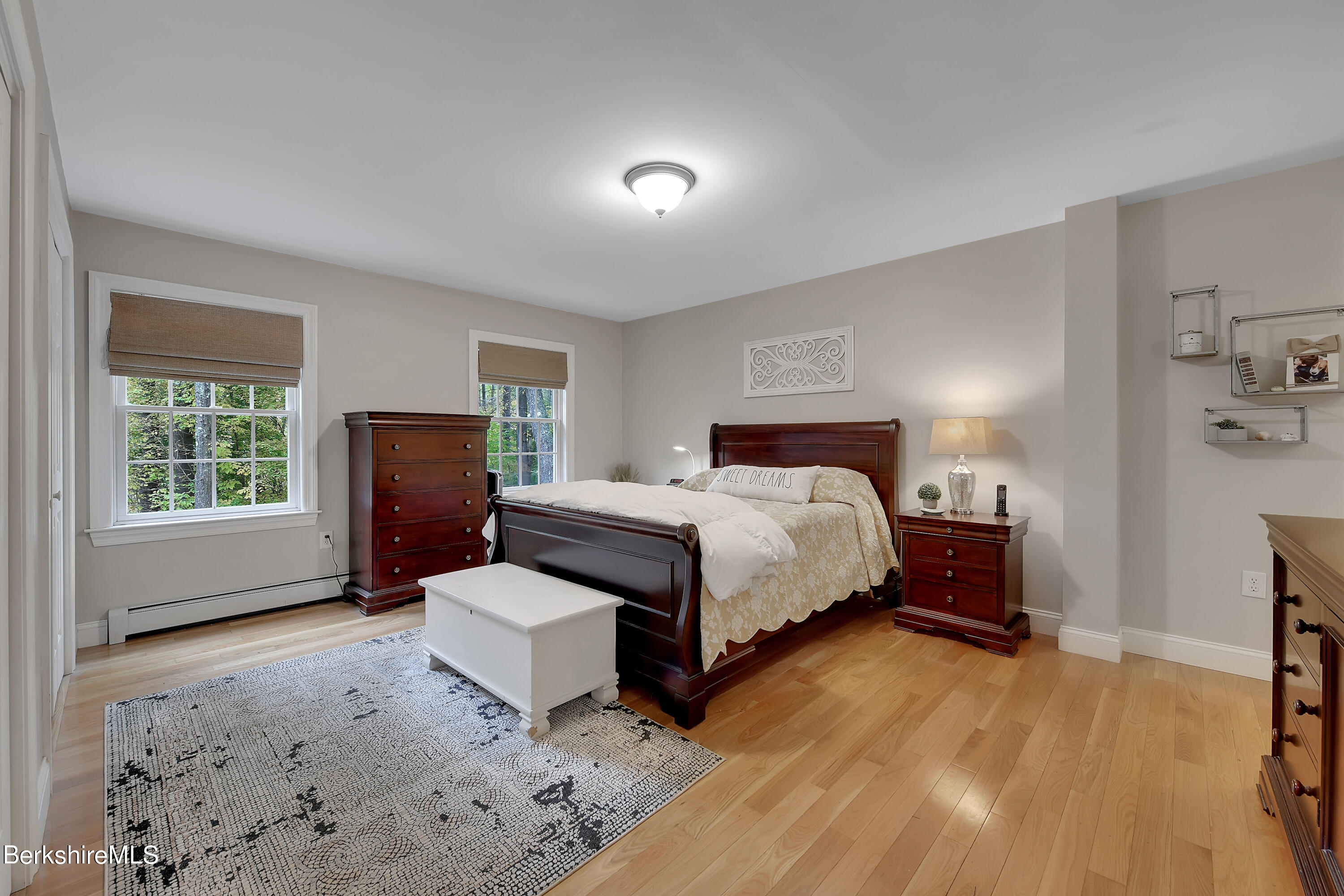 3 Ridge Street Tyringham, MA 01238 - Photo 16 of 38 a spacious bedroom with a bed and a tv on table