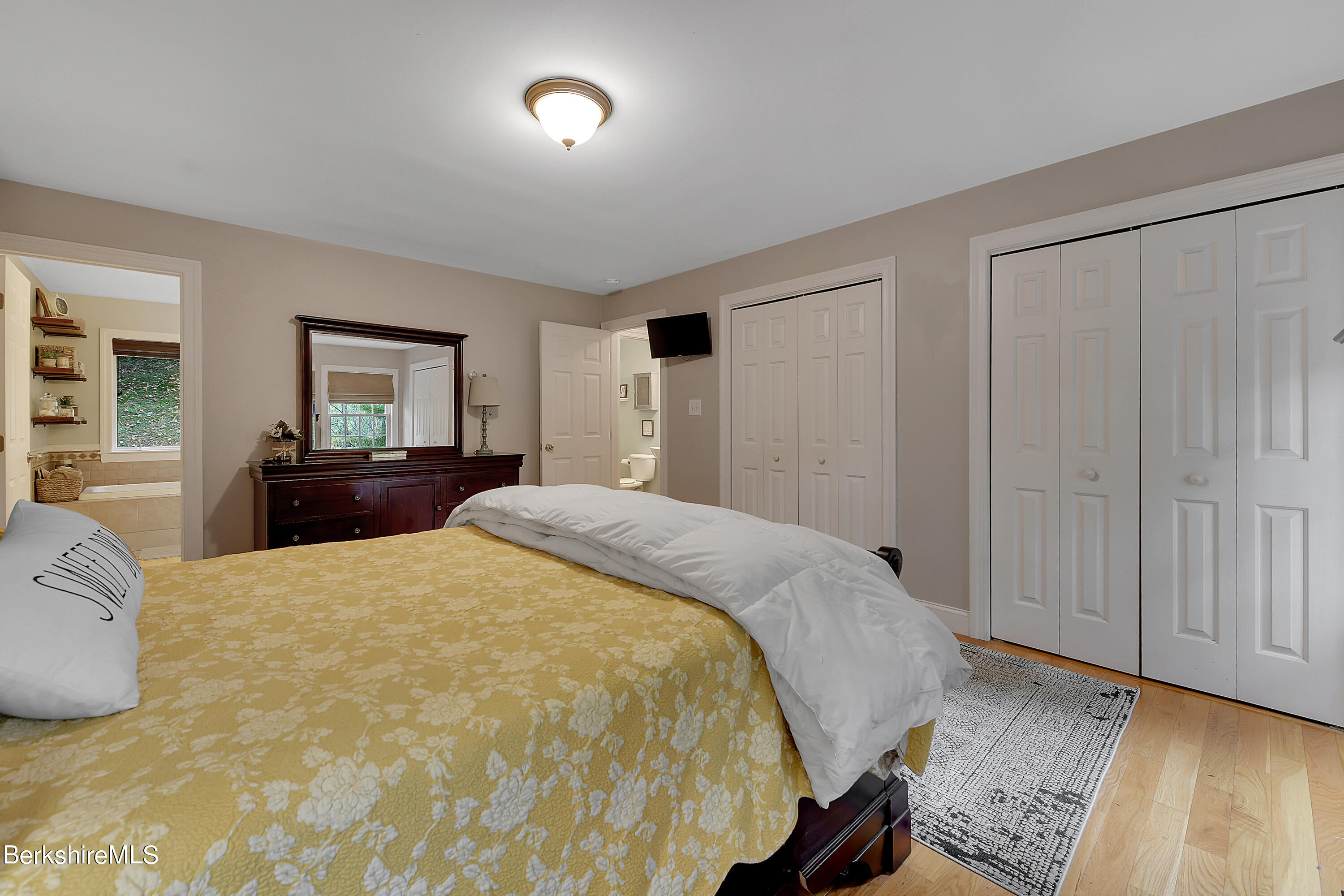 3 Ridge Street Tyringham, MA 01238 - Photo 17 of 38 a bedroom with a bed and a dresser