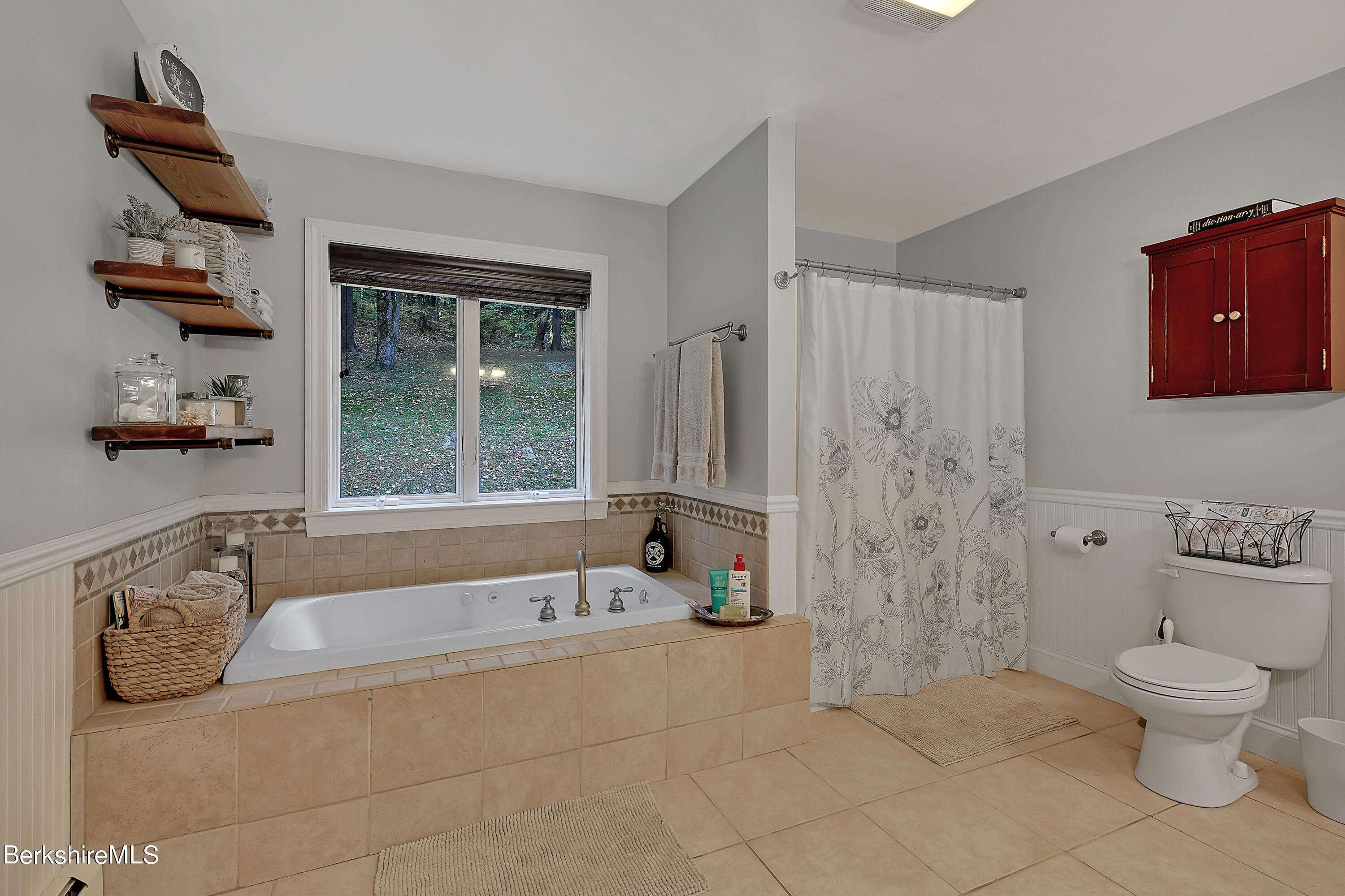 3 Ridge Street Tyringham, MA 01238 - Photo 18 of 38 a bathroom with a granite countertop toilet a sink and bathtub