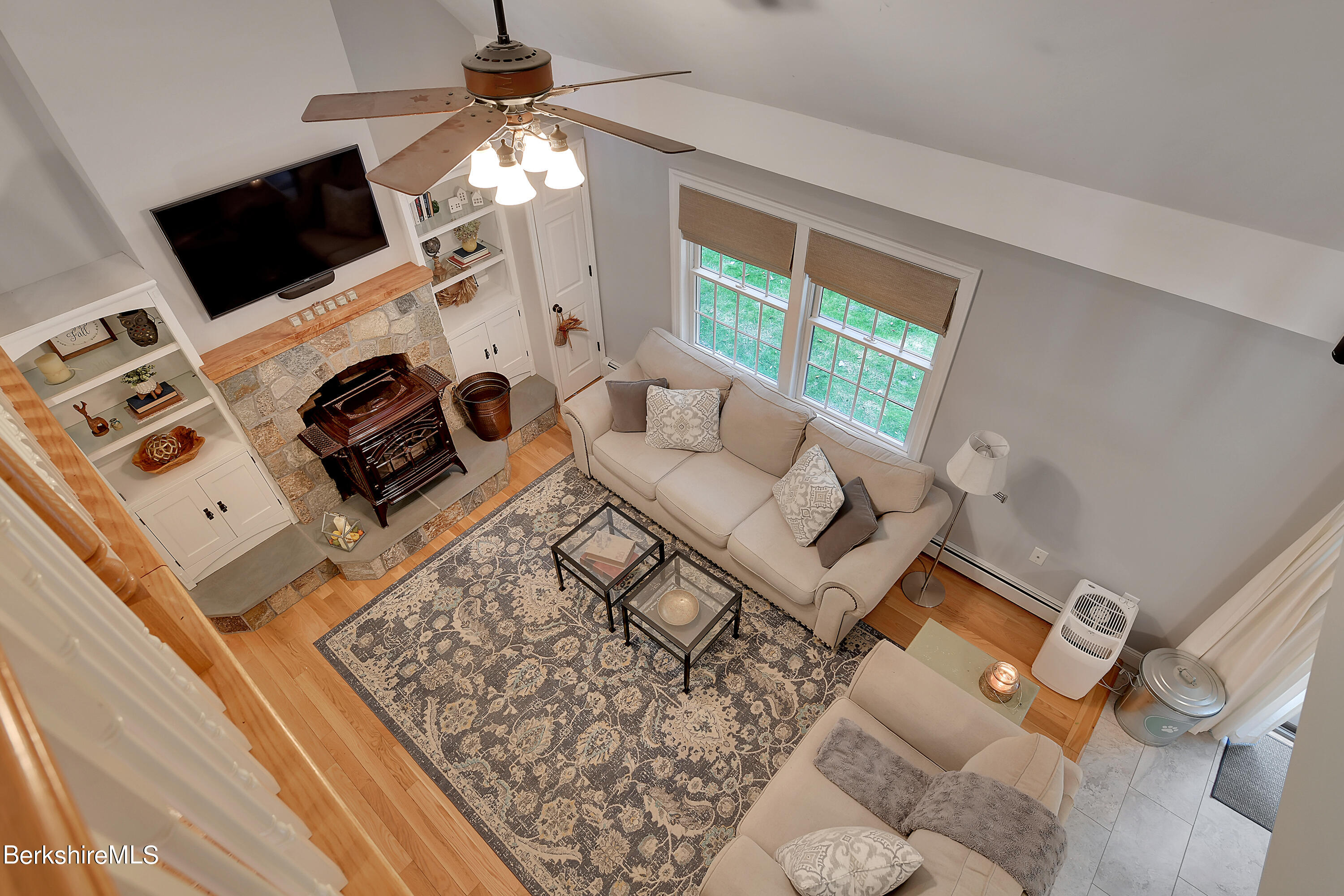 3 Ridge Street Tyringham, MA 01238 - Photo 24 of 38 a living room with furniture a flat screen tv and a fireplace