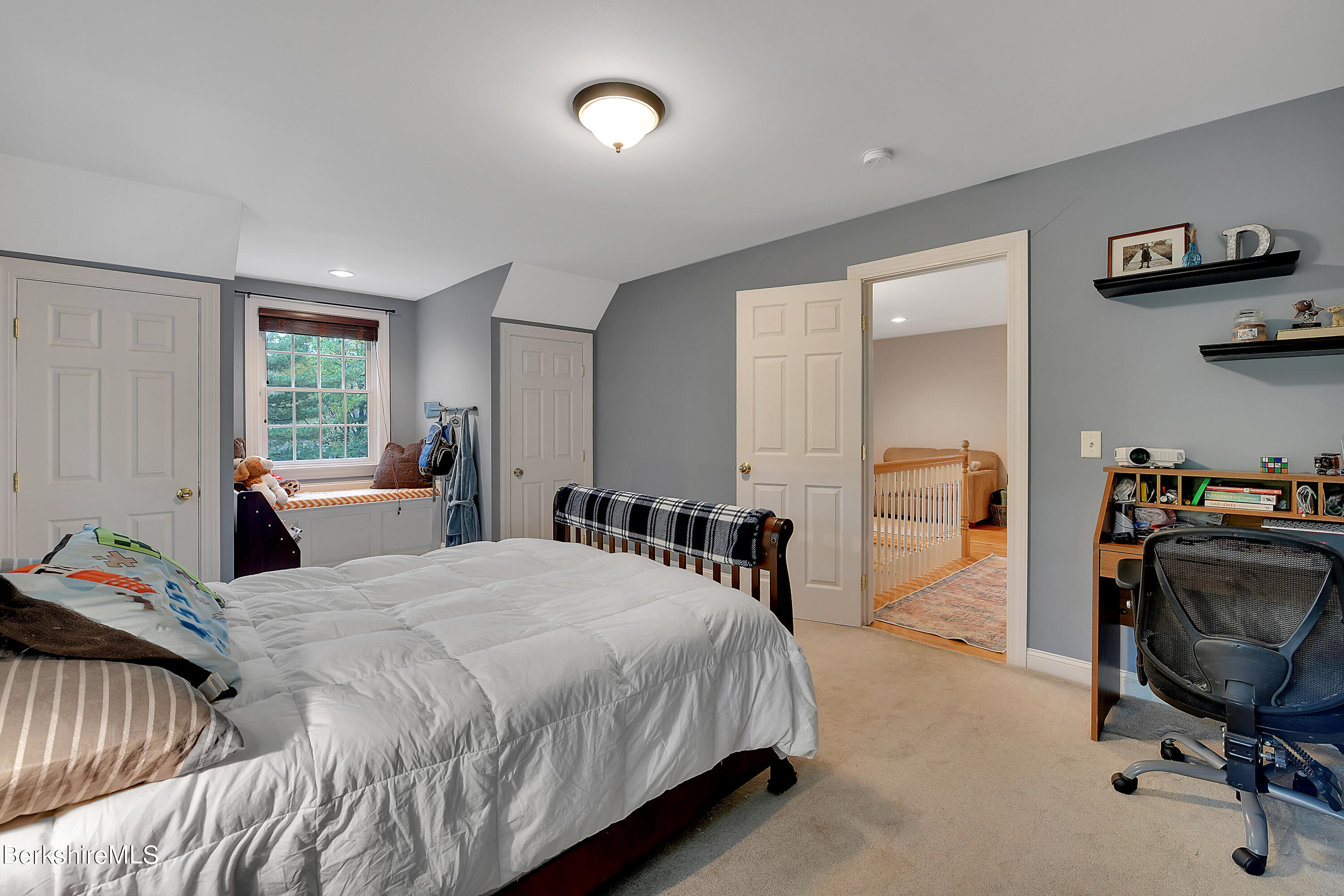 3 Ridge Street Tyringham, MA 01238 - Photo 26 of 38 a bedroom with a bed a table and chair