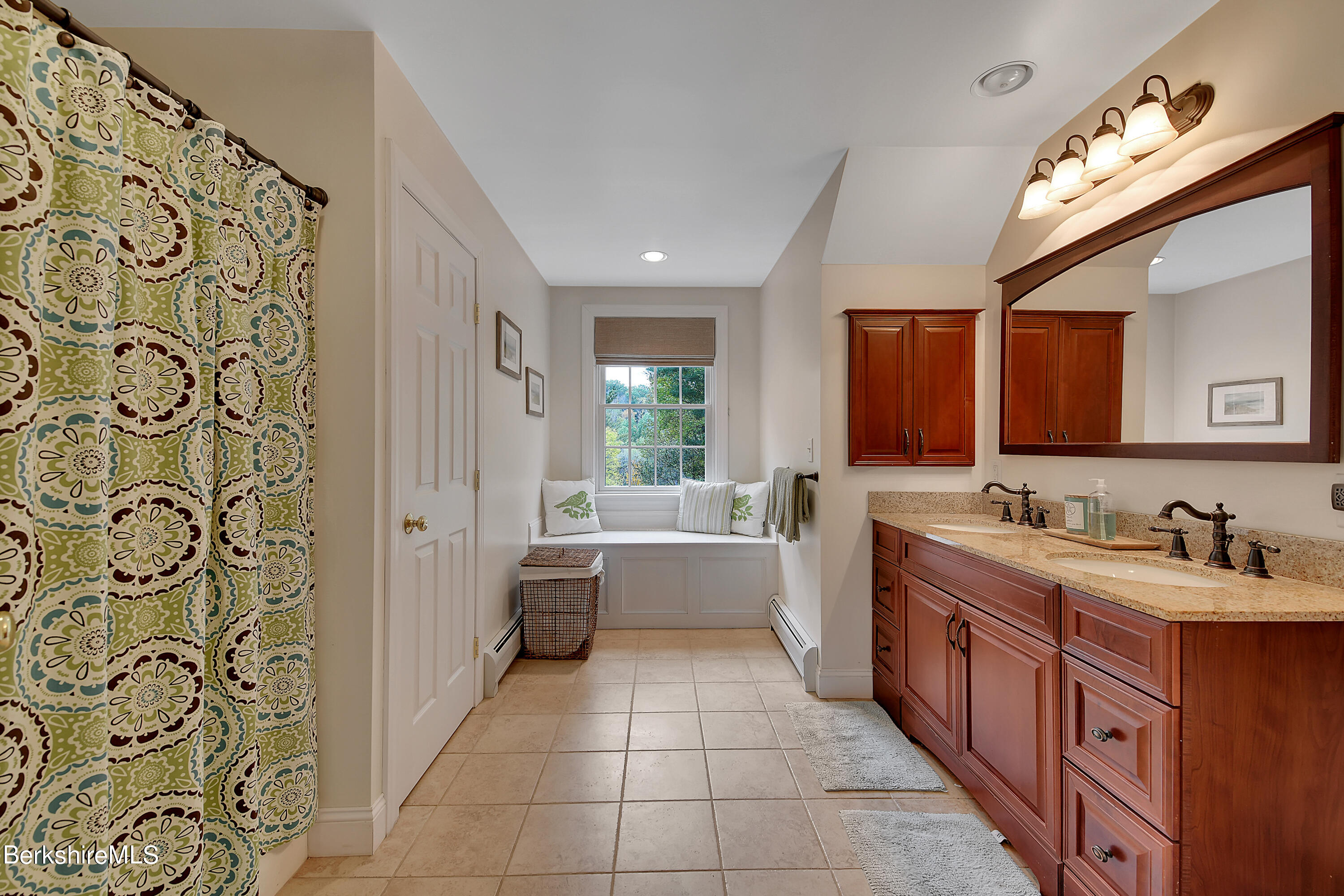 3 Ridge Street Tyringham, MA 01238 - Photo 29 of 38 a large white bathroom with a large tub sink and mirror