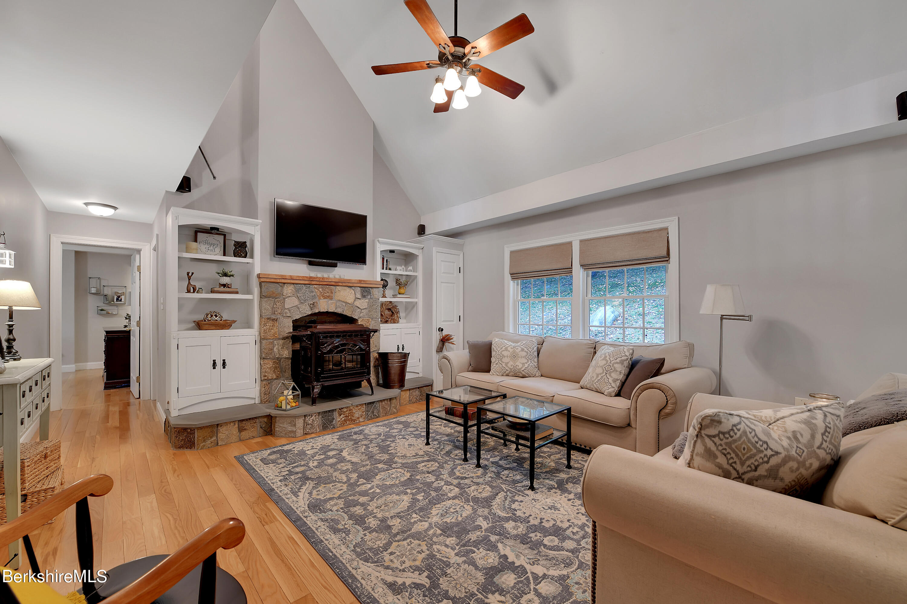 3 Ridge Street Tyringham, MA 01238 - Photo 4 of 38 a living room with furniture a fireplace and a flat screen tv