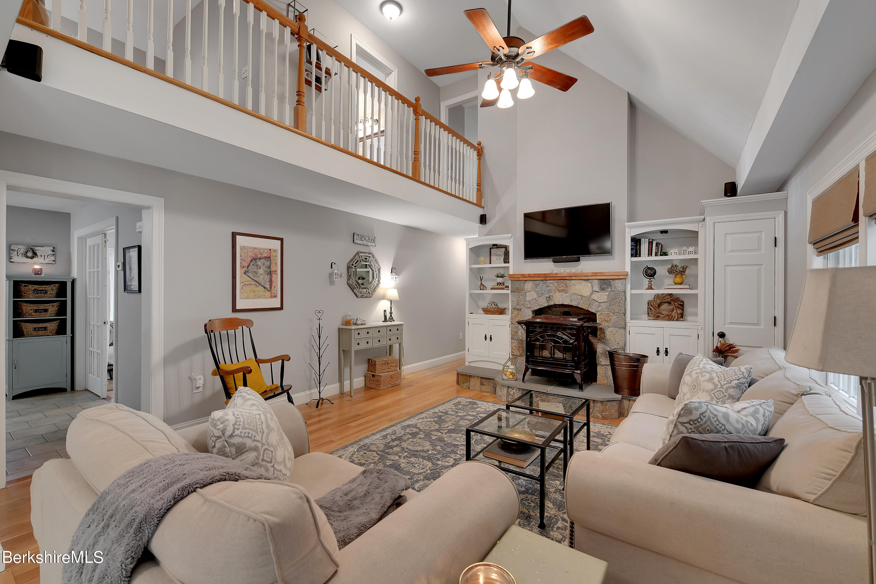3 Ridge Street Tyringham, MA 01238 - Photo 6 of 38 a living room with furniture a fireplace and a flat screen tv
