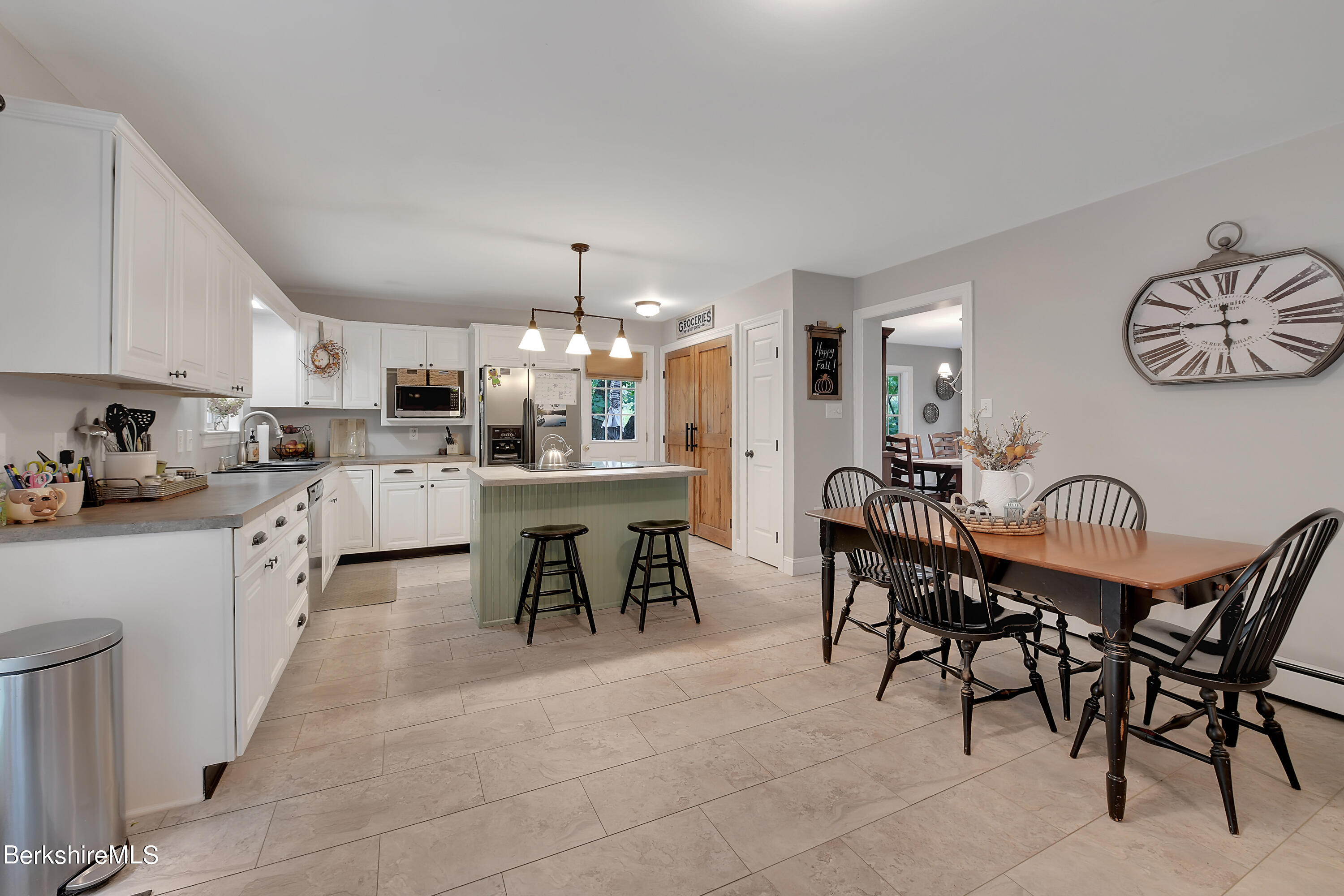 3 Ridge Street Tyringham, MA 01238 - Photo 8 of 38 a kitchen with kitchen island a dining table and chairs