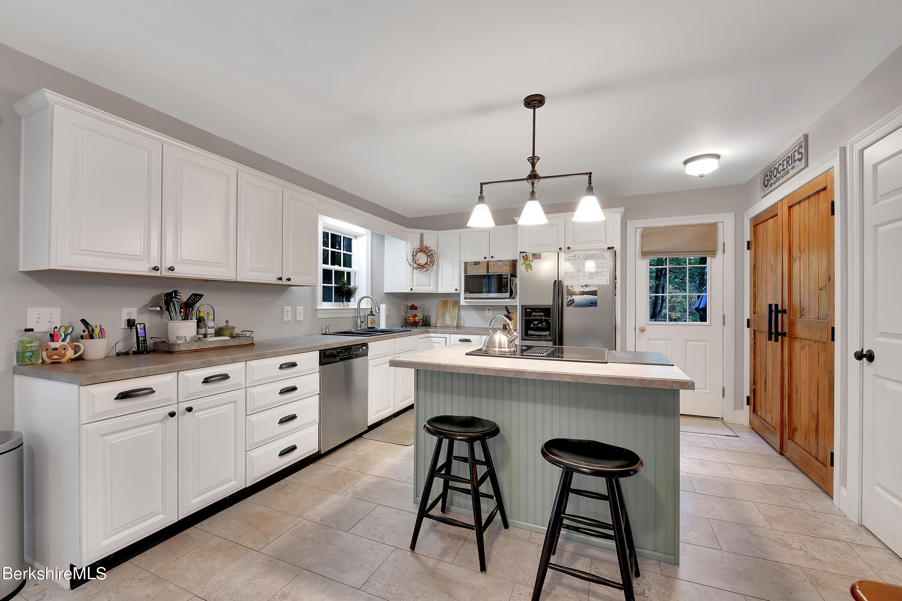 3 Ridge Street Tyringham, MA 01238 - Photo 9 of 38 a kitchen with cabinets a center island and appliances