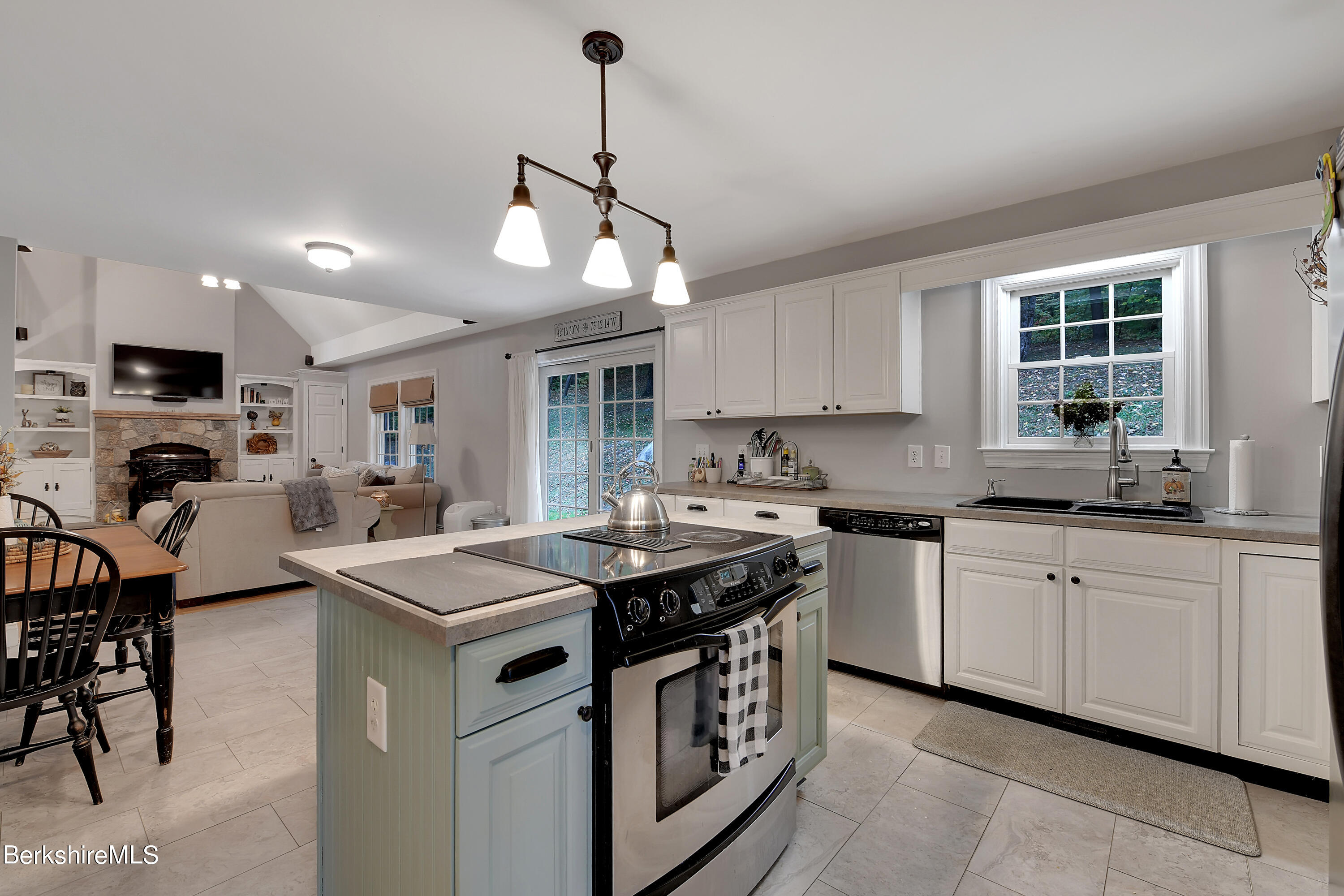 3 Ridge Street Tyringham, MA 01238 - Photo 10 of 38 a kitchen that has a sink a stove and chairs