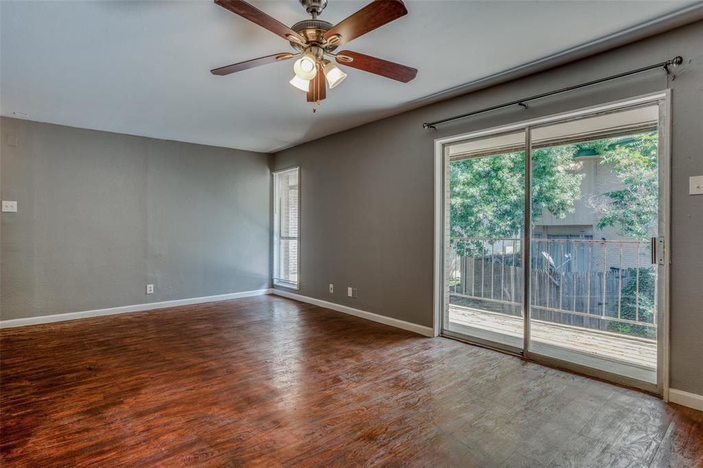 982 South Weatherred Drive, Unit B Richardson, TX 75080 - Photo 2 of 13 Spare room with wood finished floors and ceiling fan
