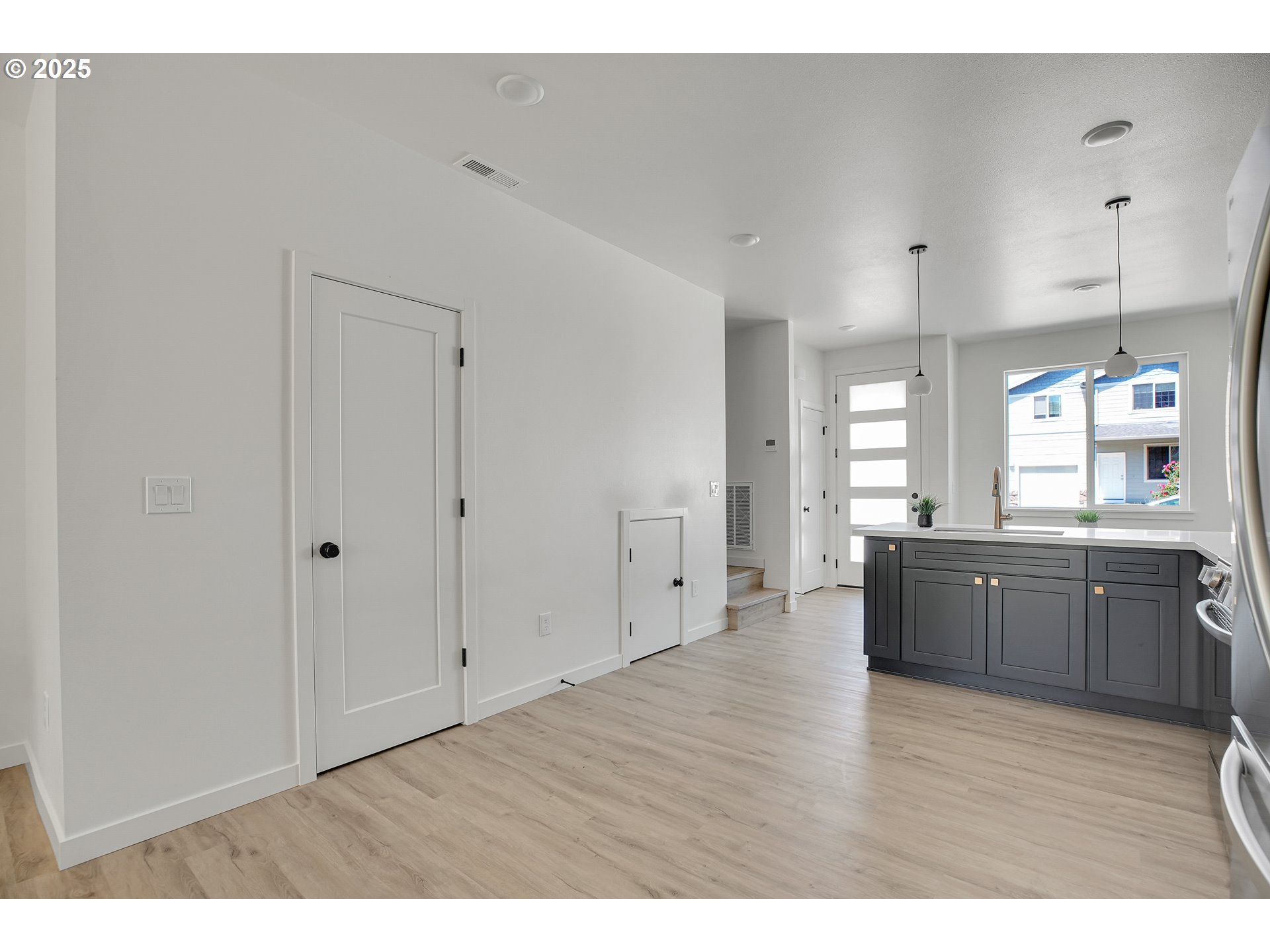 14822 Northeast Couch Street, Unit 4 Portland, OR 97230 - Photo 11 of 42 a large room with wooden floor