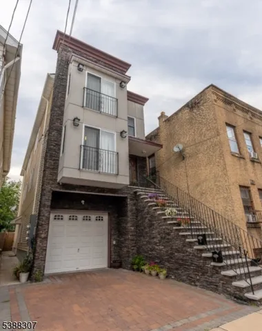 a front view of a house with a garage