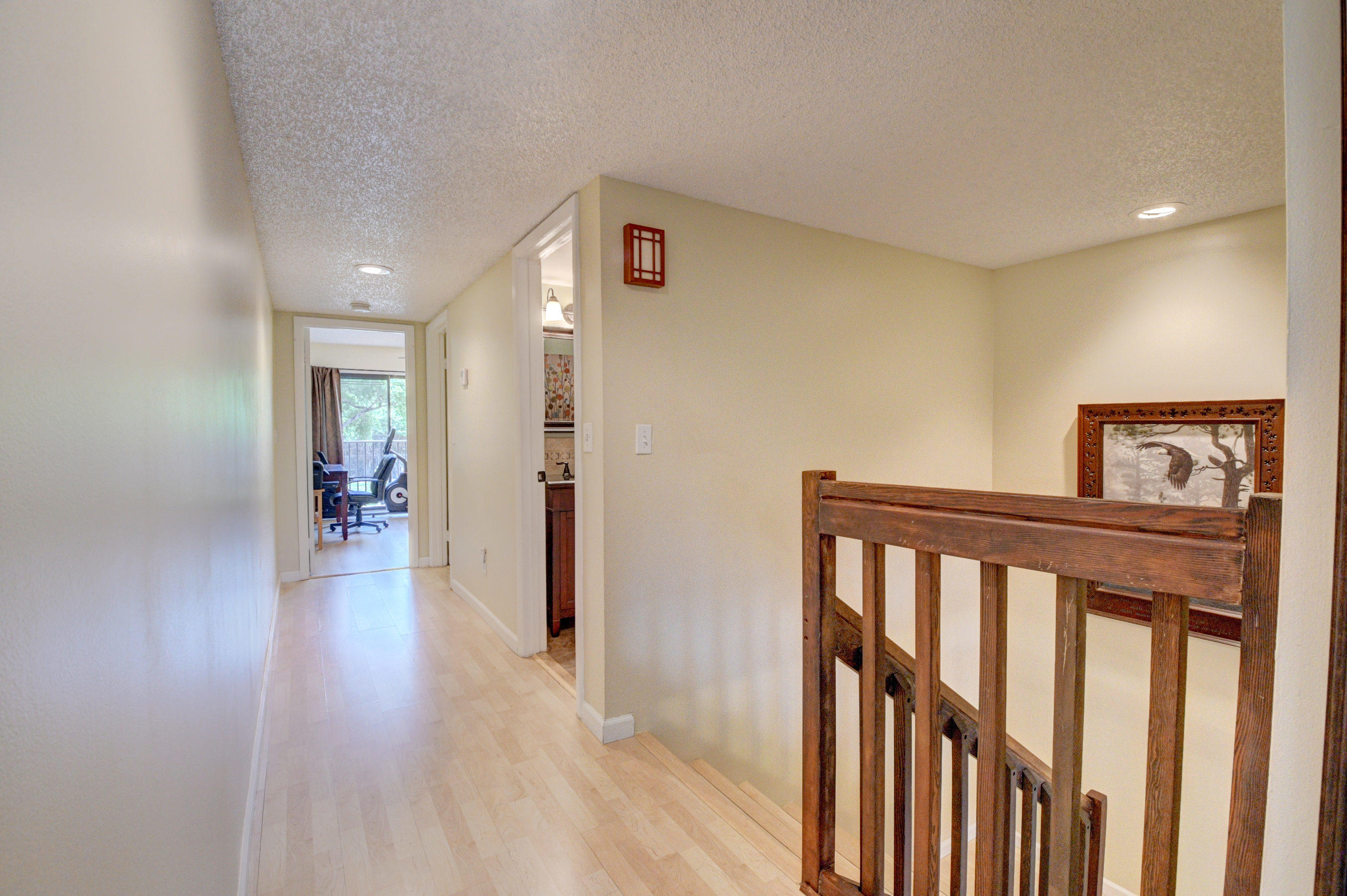 8165 Boca Rio Drive Boca Raton, FL 33433 - Photo 48 of 49 a view of a hallway to a livingroom with wooden floor and furniture
