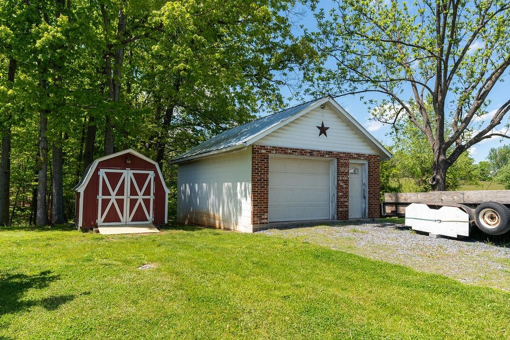 389 Jericho Road Fishersville, VA 22939 - Photo 51 of 75 a front view of a house with a yard and garage