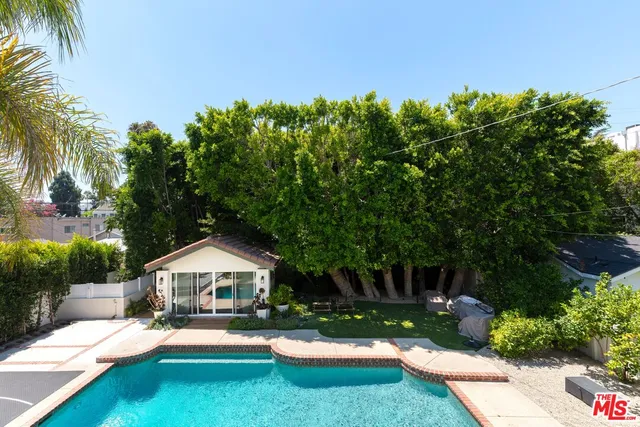 a bathroom with a double vanity sink toilet mirror and shower