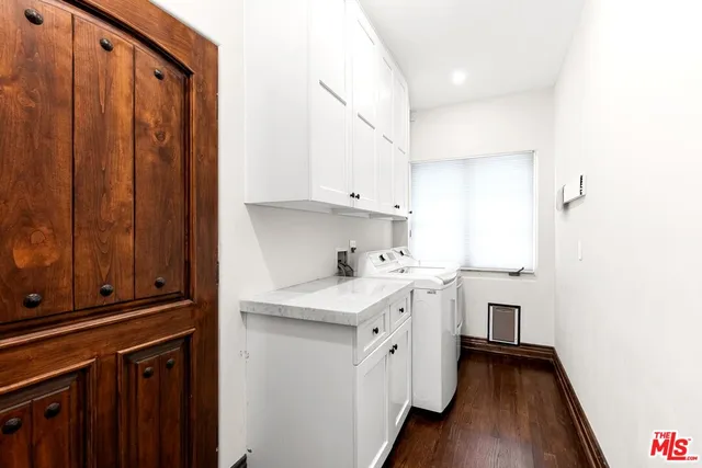 a front view of house with yard and trees around