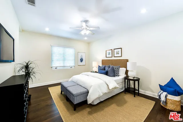 a view of a backyard with plants and patio