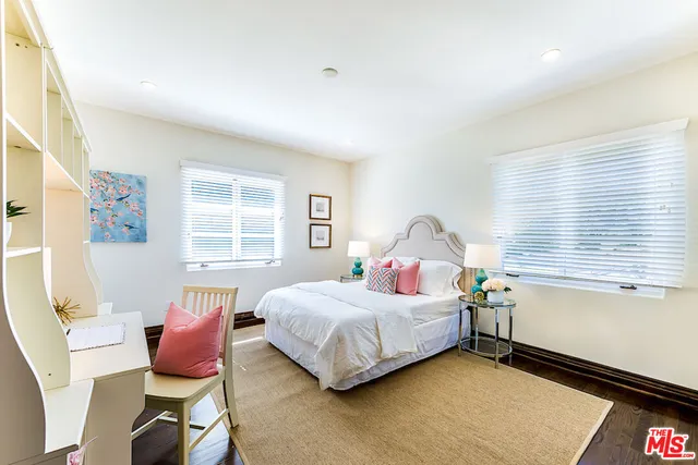 a view of a house with pool and chairs