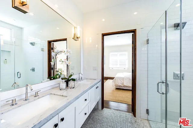 a view of a house with pool and chairs