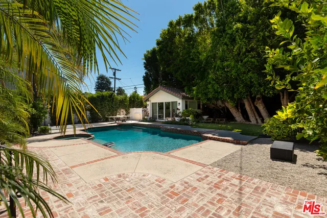 a front view of a house with a yard table and chairs