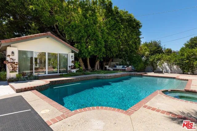 a view of a house with a swimming pool