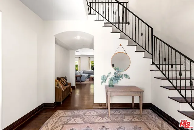 a kitchen with kitchen island a dining table and chairs