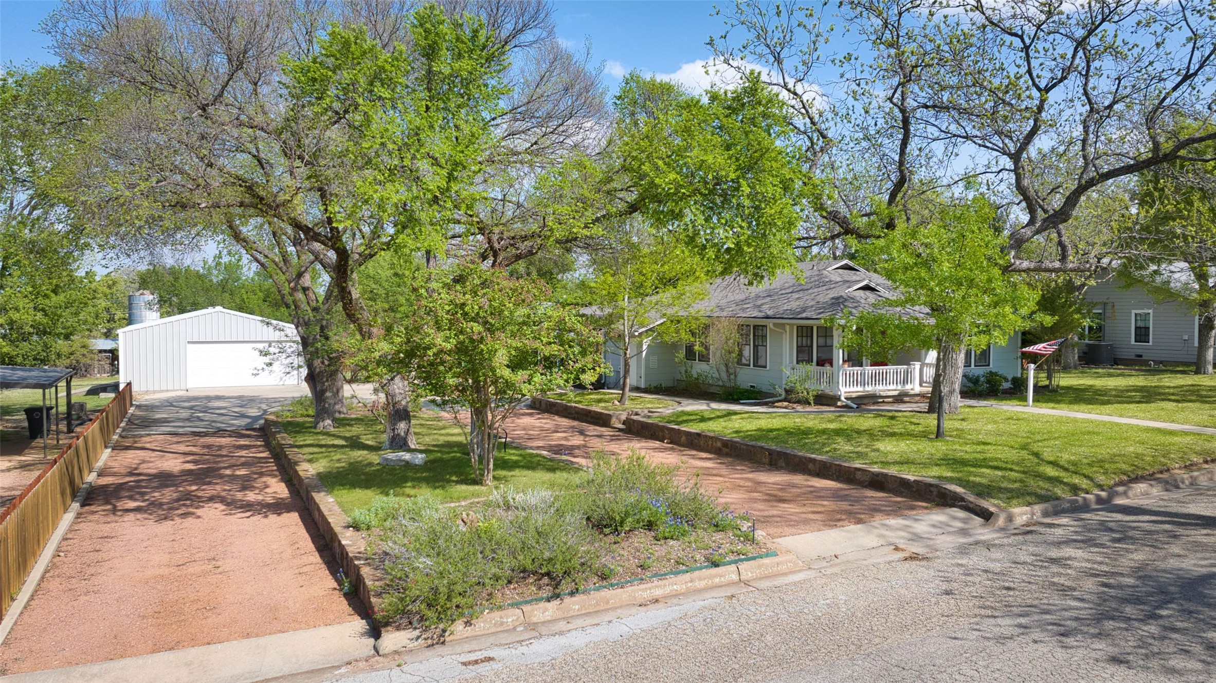 761 Post Hill Street Mason, TX 76856 - Photo 15 of 25 a front view of a house with a yard and shrubs