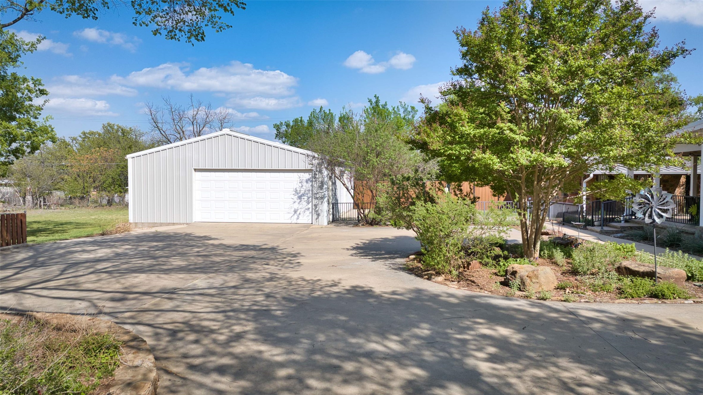761 Post Hill Street Mason, TX 76856 - Photo 17 of 25 a front view of a house with a yard and garage