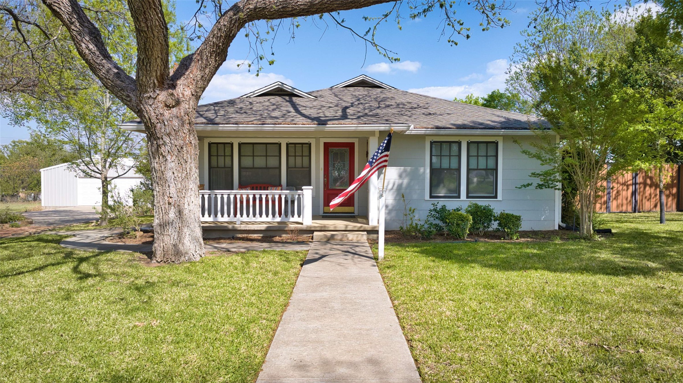 761 Post Hill Street Mason, TX 76856 - Photo 18 of 25 a front view of a house with a yard and table and chairs